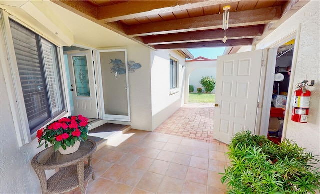 entrance to property with a patio area