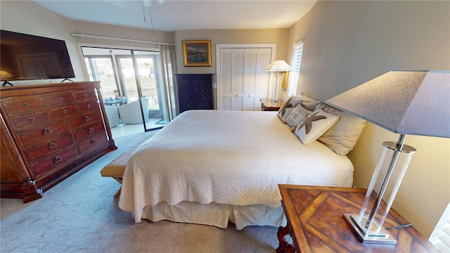 carpeted bedroom featuring access to outside