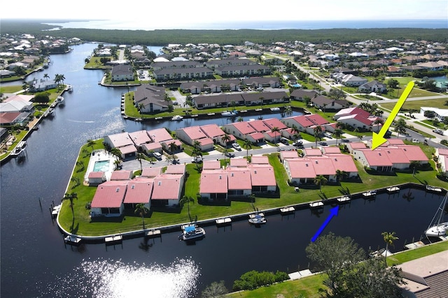 birds eye view of property featuring a water view