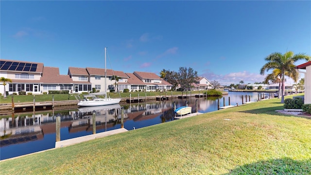 dock area featuring a yard and a water view