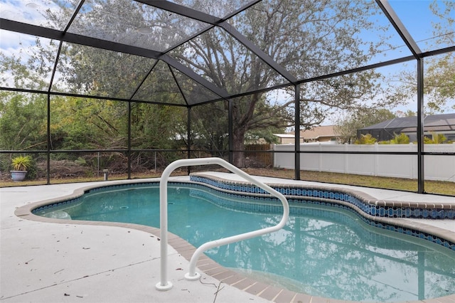 view of swimming pool with a lanai