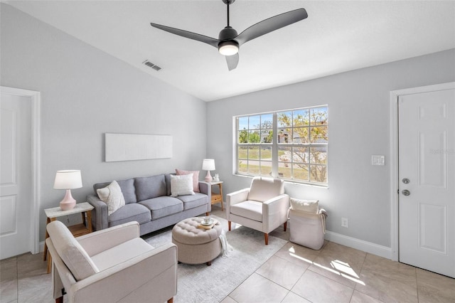 living area featuring light tile patterned floors, baseboards, visible vents, a ceiling fan, and lofted ceiling