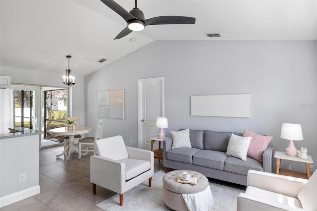 tiled living room featuring lofted ceiling, visible vents, baseboards, and ceiling fan with notable chandelier