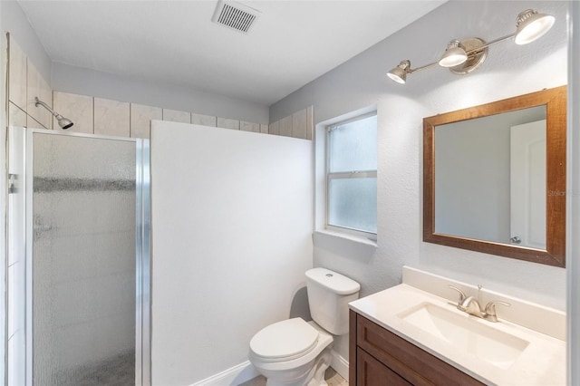 full bathroom featuring toilet, a shower stall, visible vents, and vanity