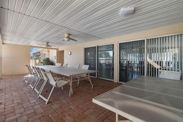 view of patio featuring ceiling fan