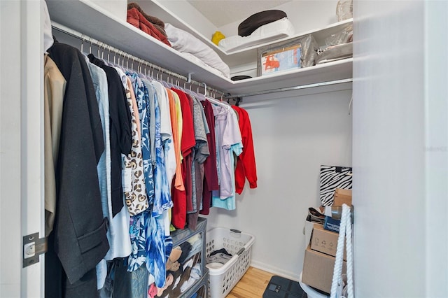 spacious closet featuring hardwood / wood-style floors