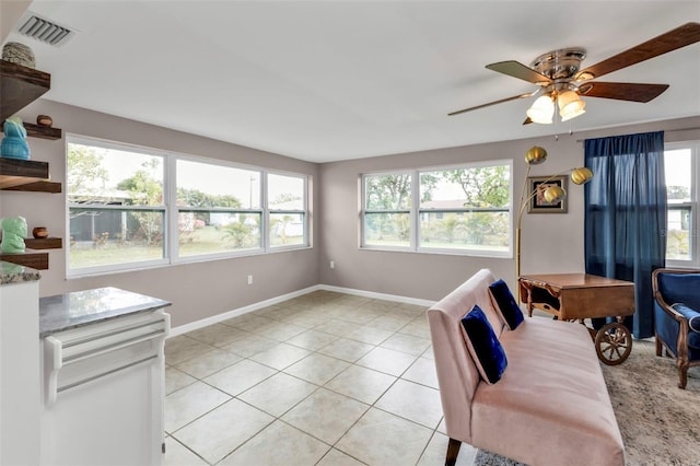 interior space featuring ceiling fan