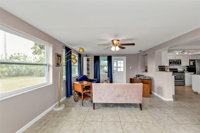 tiled living room featuring ceiling fan