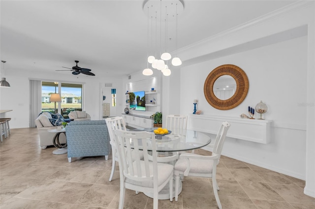 dining room featuring ceiling fan and ornamental molding