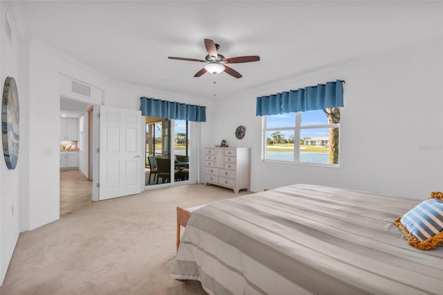 carpeted bedroom featuring ornamental molding, access to outside, and ceiling fan