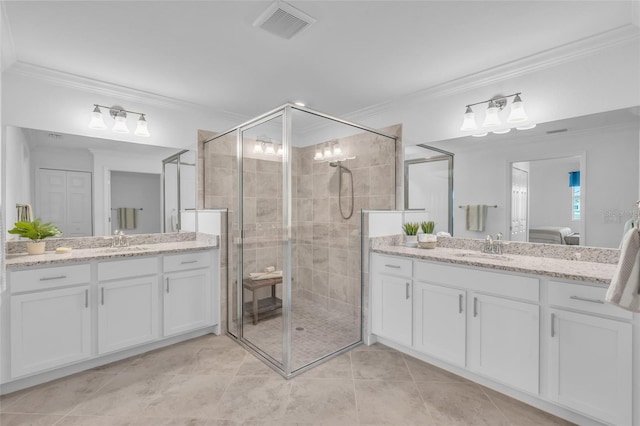 bathroom featuring walk in shower, ornamental molding, tile patterned flooring, and vanity