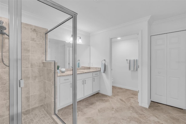 bathroom with vanity, crown molding, and a shower with door