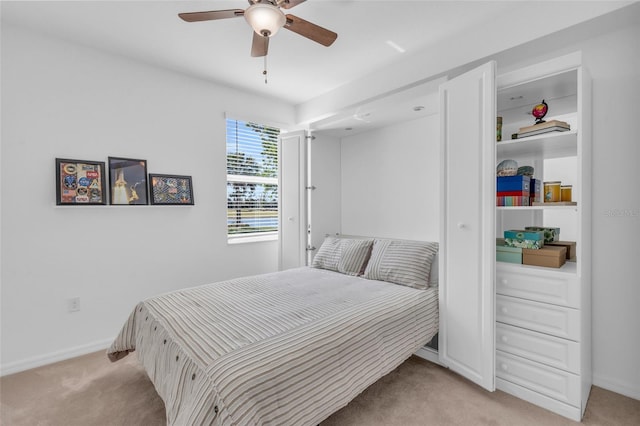 bedroom with light colored carpet and ceiling fan