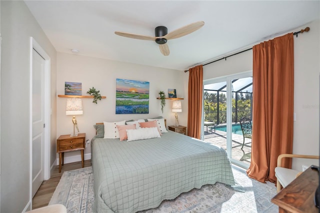 bedroom featuring access to exterior, ceiling fan, and light hardwood / wood-style flooring