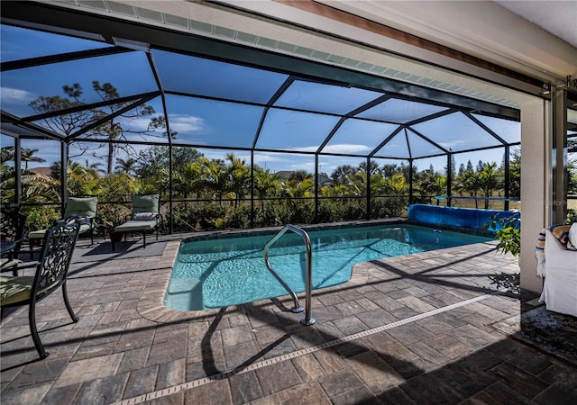 view of pool with a lanai and a patio