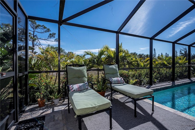 exterior space with a patio area and glass enclosure