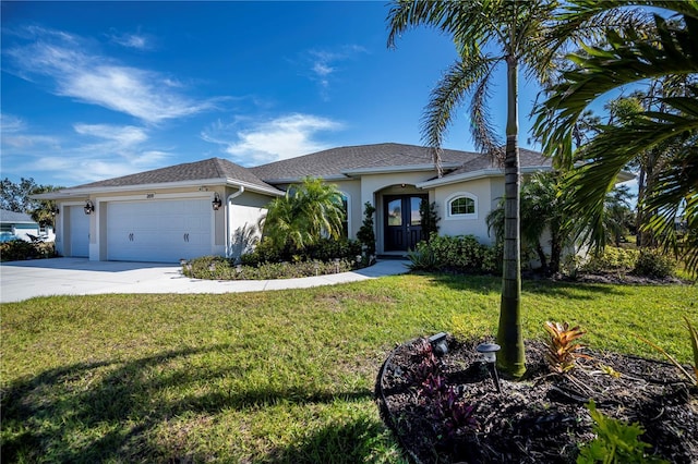 view of front of property with a garage and a front lawn