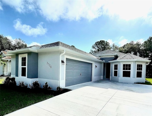 ranch-style home featuring a garage