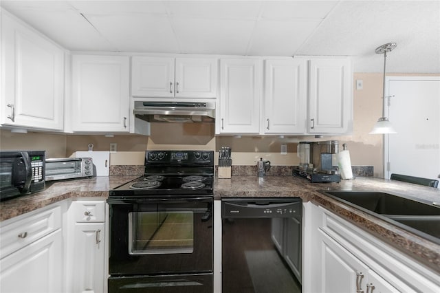 kitchen with sink, decorative light fixtures, black appliances, and white cabinets