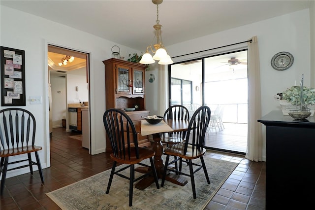 dining space featuring dark tile patterned flooring