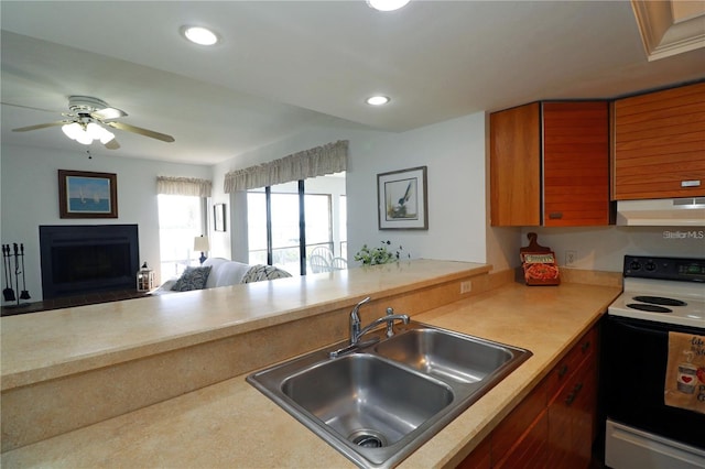 kitchen with sink, range with electric cooktop, and ceiling fan