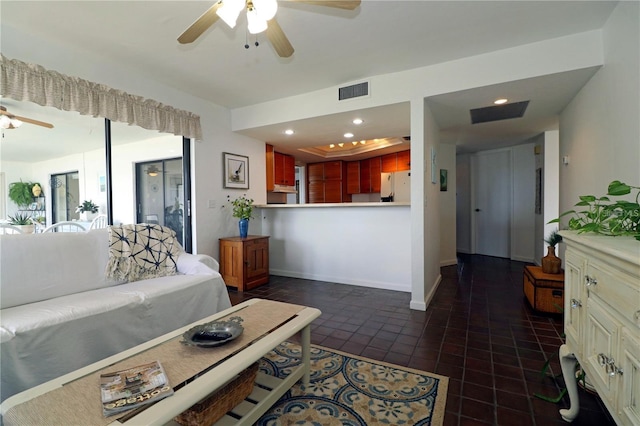 tiled living room featuring ceiling fan