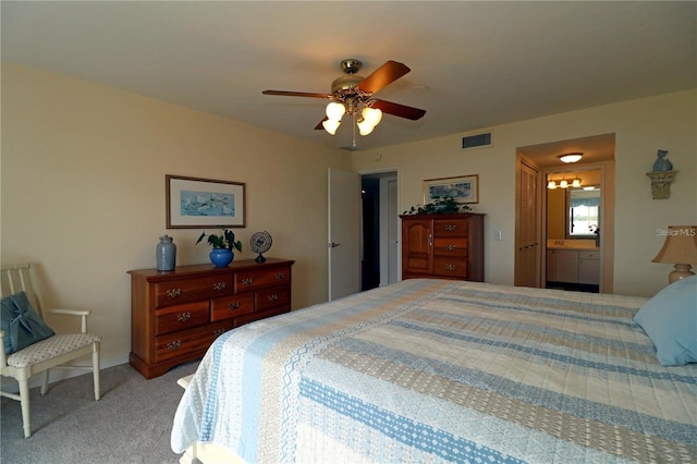 carpeted bedroom with ceiling fan and a closet