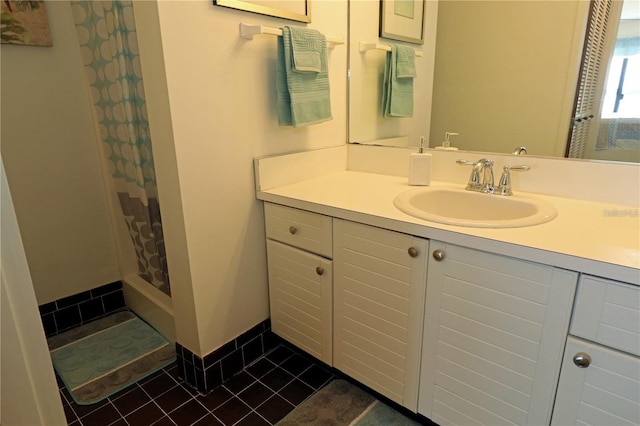 bathroom featuring vanity, a shower with curtain, and tile patterned floors