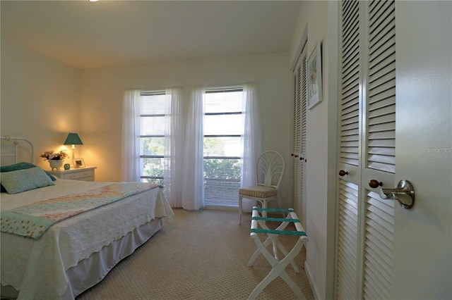 bedroom with light carpet