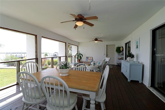 dining area featuring ceiling fan, dark hardwood / wood-style floors, and a healthy amount of sunlight