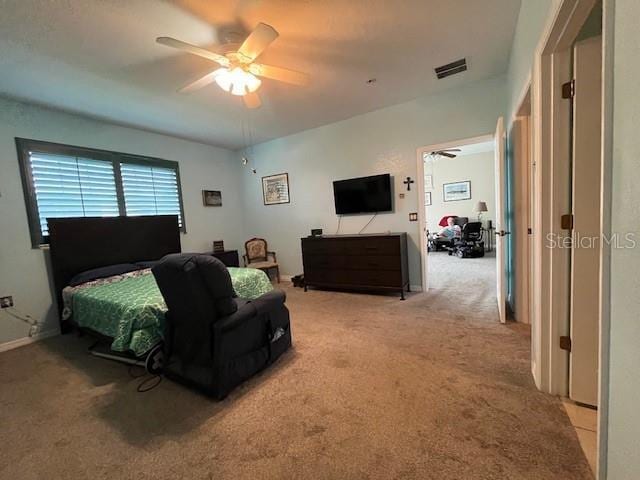 bedroom with light colored carpet and ceiling fan