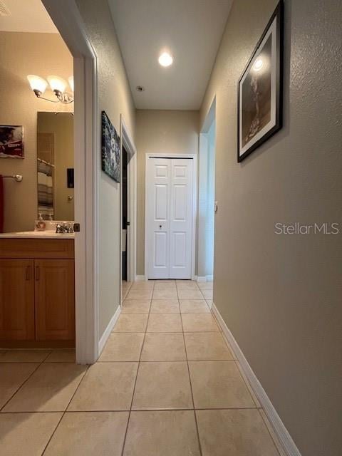 corridor with light tile patterned floors