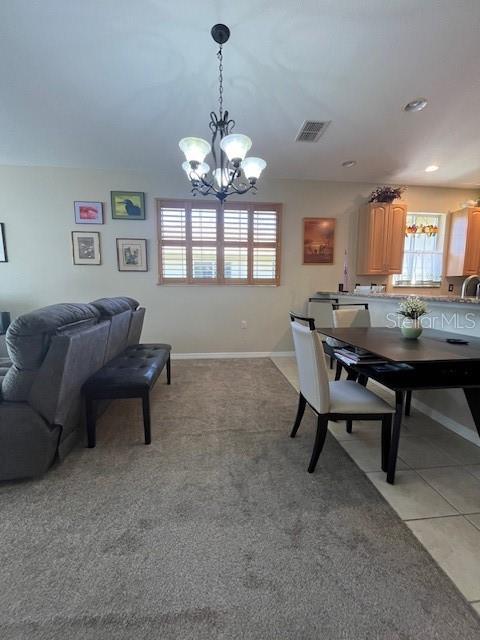 dining space featuring light tile patterned flooring