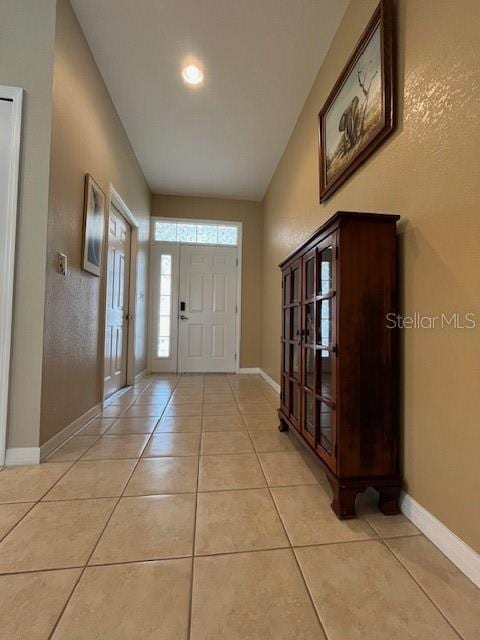 entrance foyer featuring light tile patterned floors