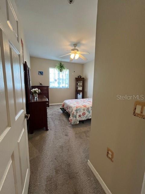 bedroom with carpet flooring and ceiling fan