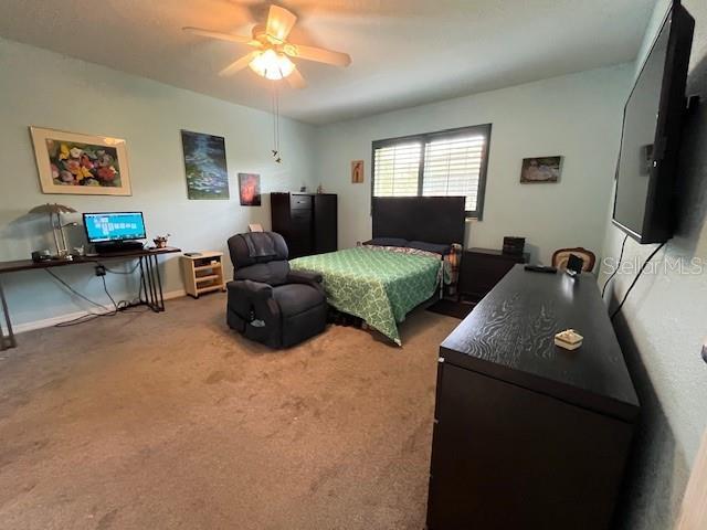 bedroom with carpet and ceiling fan