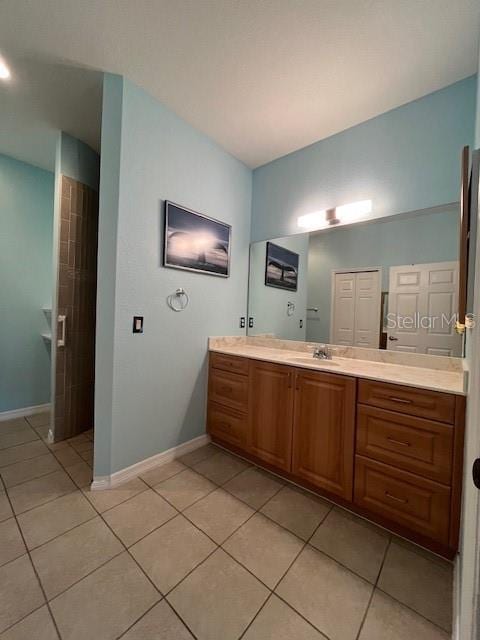 bathroom with vanity and tile patterned flooring