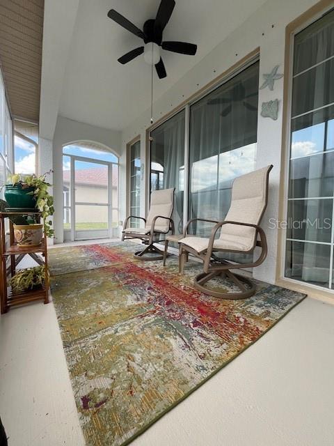 sunroom / solarium with ceiling fan