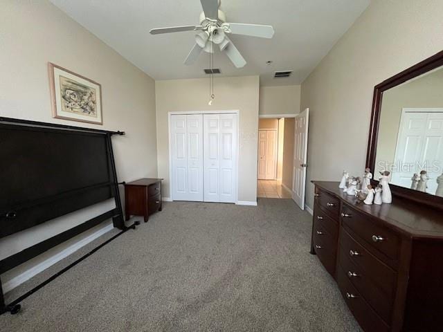 bedroom featuring baseboards, a closet, visible vents, and carpet