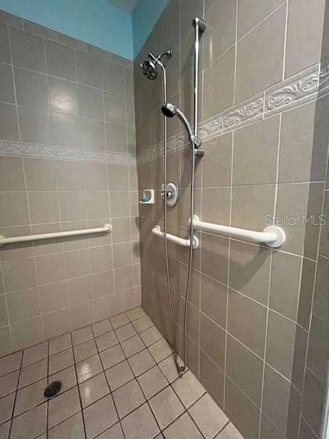 bathroom featuring a shower stall and tile patterned floors
