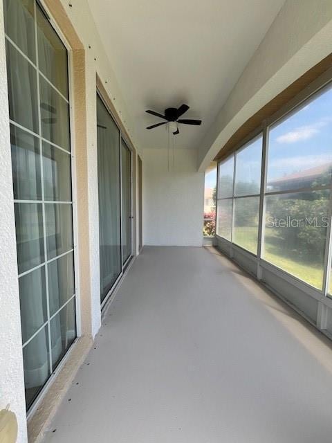 exterior space featuring concrete floors and ceiling fan