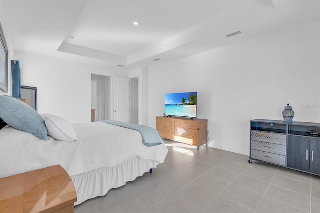 tiled bedroom with a raised ceiling