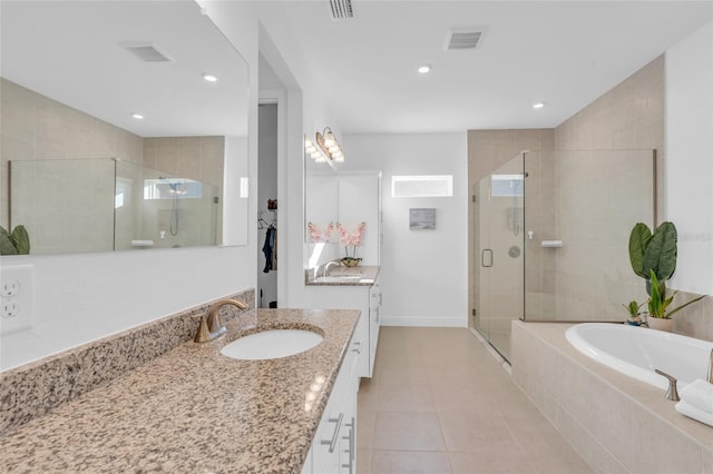 bathroom with vanity, independent shower and bath, and tile patterned flooring