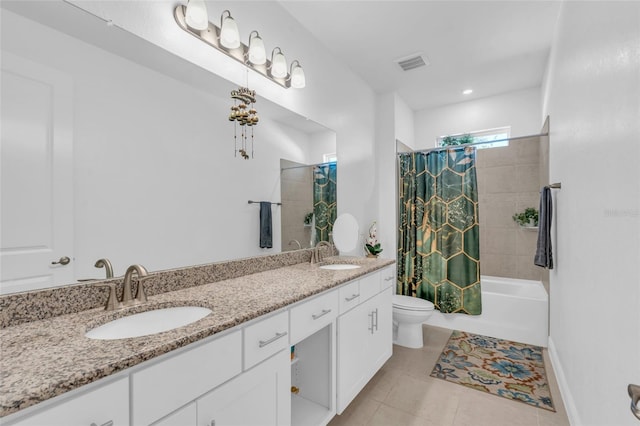 full bathroom with vanity, toilet, tile patterned flooring, and shower / bath combo with shower curtain