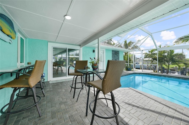 view of pool featuring a lanai and a patio area