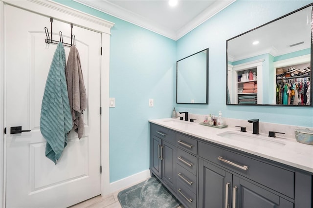 bathroom featuring vanity and crown molding