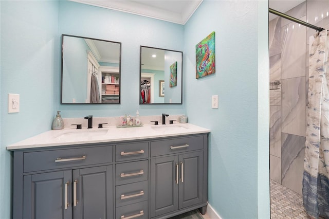 bathroom featuring crown molding, vanity, and a shower with shower curtain