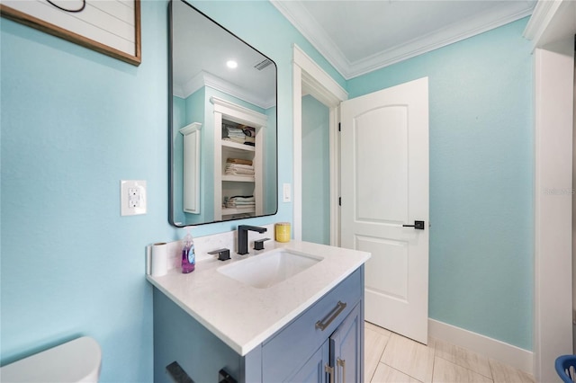 bathroom featuring ornamental molding, vanity, tile patterned floors, and toilet