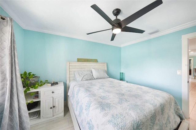 bedroom featuring ornamental molding and ceiling fan