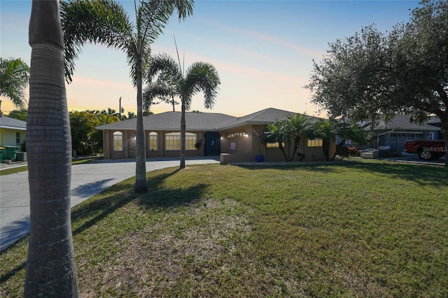 ranch-style house with a yard